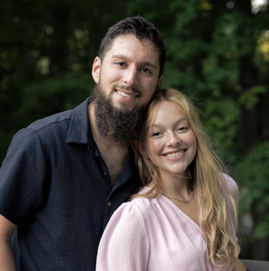 Duvy Burston outdoors with a smiling woman